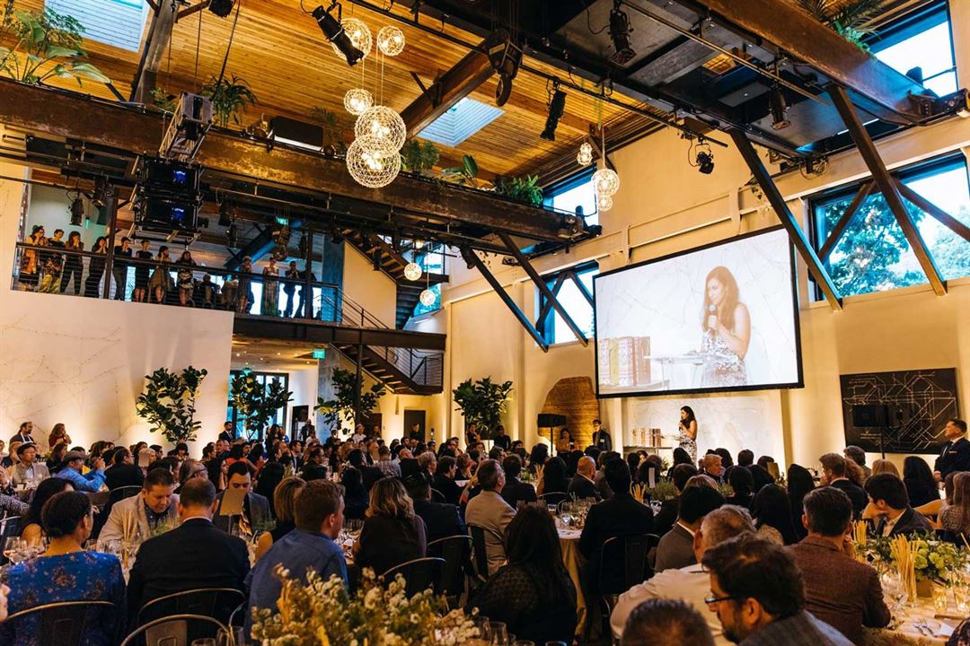The Pearl main floor with reclaimed cedar ceiling during a seated program